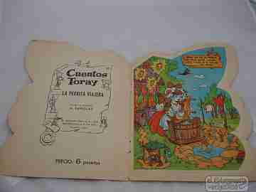 Libro troquelado. La perrita viajera. Guión y dibujos Bañolas. Toray