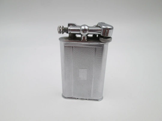 Lift arm manual Polo petrol lighter. Silver plated brass. Waves pattern. United Kingdom Lift arm manual Polo petrol lighter. Silver plated brass. Waves pattern. United Kingdom