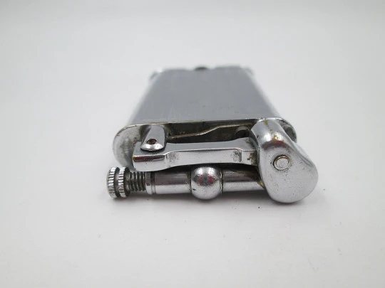 Lift arm manual Polo petrol lighter. Silver plated brass. Waves pattern. United Kingdom Lift arm manual Polo petrol lighter. Silver plated brass. Waves pattern. United Kingdom