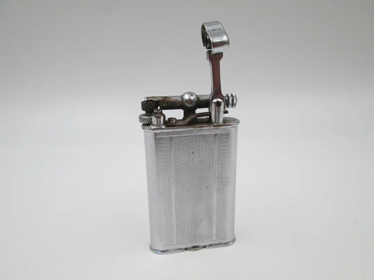 Lift arm manual Polo petrol lighter. Silver plated brass. Waves pattern. United Kingdom Lift arm manual Polo petrol lighter. Silver plated brass. Waves pattern. United Kingdom