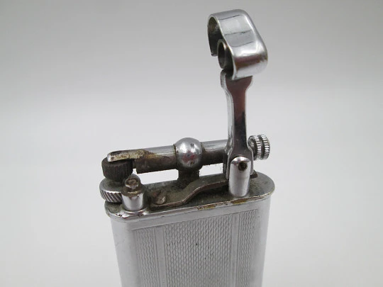 Lift arm manual Polo petrol lighter. Silver plated brass. Waves pattern. United Kingdom Lift arm manual Polo petrol lighter. Silver plated brass. Waves pattern. United Kingdom