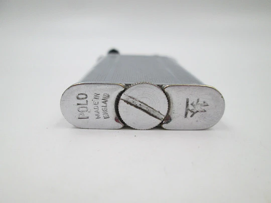 Lift arm manual Polo petrol lighter. Silver plated brass. Waves pattern. United Kingdom Lift arm manual Polo petrol lighter. Silver plated brass. Waves pattern. United Kingdom