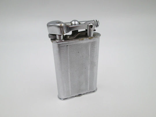 Lift arm manual Polo petrol lighter. Silver plated brass. Waves pattern. United Kingdom Lift arm manual Polo petrol lighter. Silver plated brass. Waves pattern. United Kingdom
