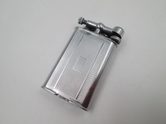 Lift arm manual Polo petrol lighter. Silver plated brass. Waves pattern. United Kingdom Lift arm manual Polo petrol lighter. Silver plated brass. Waves pattern. United Kingdom