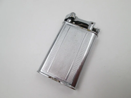 Lift arm manual Polo petrol lighter. Silver plated brass. Waves pattern. United Kingdom Lift arm manual Polo petrol lighter. Silver plated brass. Waves pattern. United Kingdom