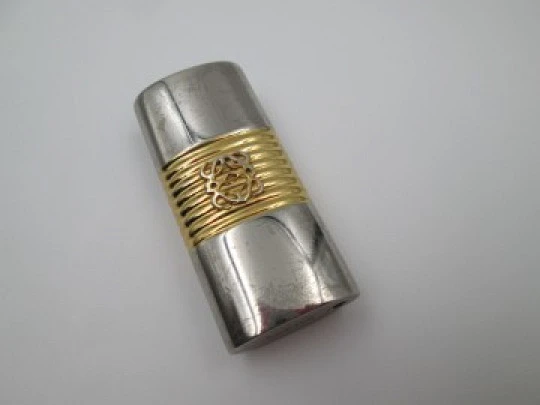 Loewe lighter cover. Silver and gold plated metal. Brand logo. Spain. 2010
