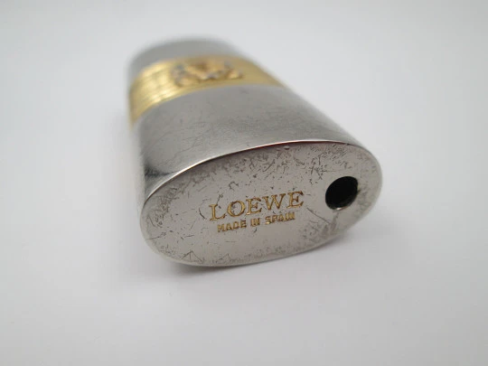 Loewe lighter cover. Silver and gold plated metal. Brand logo. Spain. 2010