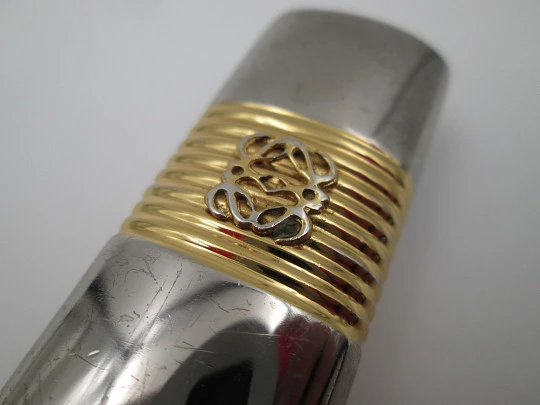 Loewe lighter cover. Silver and gold plated metal. Brand logo. Spain. 2010