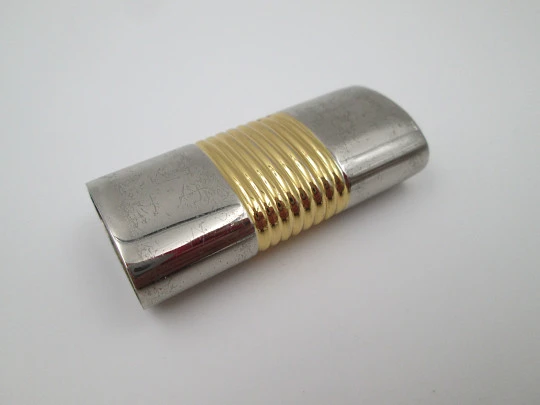 Loewe lighter cover. Silver and gold plated metal. Brand logo. Spain. 2010