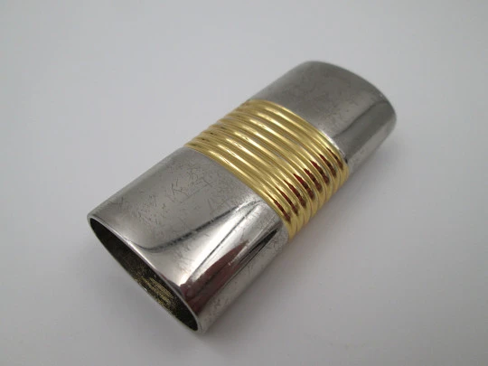 Loewe lighter cover. Silver and gold plated metal. Brand logo. Spain. 2010