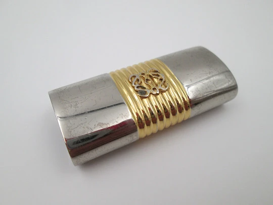 Loewe lighter cover. Silver and gold plated metal. Brand logo. Spain. 2010