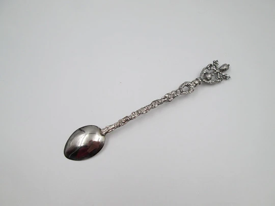 Long ornamental spoon. Silver-plated metal. Papal coat of arms and floral motifs. 1980's Long ornamental spoon. Silver-plated metal. Papal coat of arms and floral motifs. 1980's