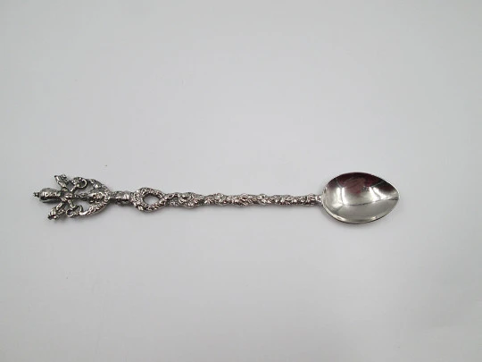 Long ornamental spoon. Silver-plated metal. Papal coat of arms and floral motifs. 1980's Long ornamental spoon. Silver-plated metal. Papal coat of arms and floral motifs. 1980's