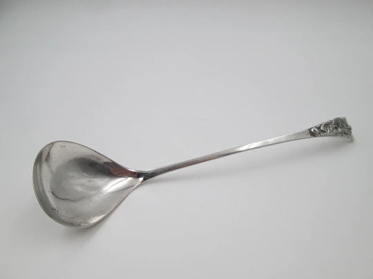 Long serving spoon. 800 sterling silver. Curved handled. Flowers and leaves. 1970's