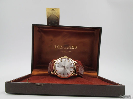 Longines Conquest. 18k yellow gold. Automatic. Date. Enamel anagram