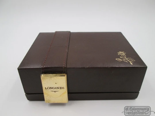 Longines Conquest. 18k yellow gold. Automatic. Date. Enamel anagram