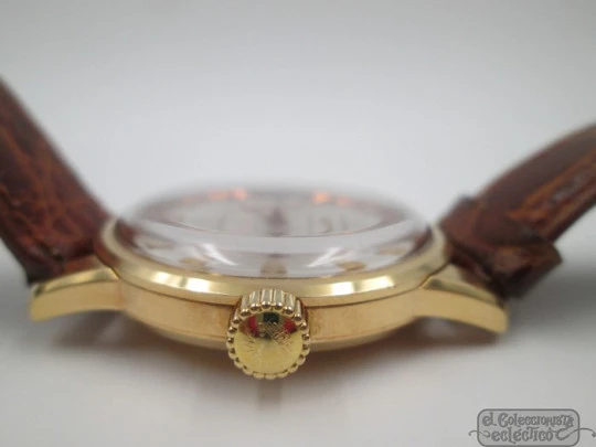 Longines Conquest. 18k yellow gold. Automatic. Date. Enamel anagram
