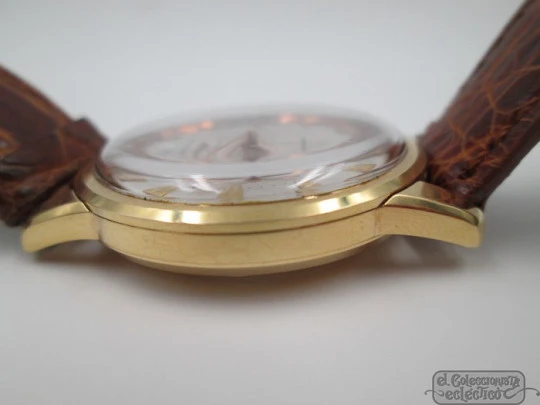 Longines Conquest. 18k yellow gold. Automatic. Date. Enamel anagram