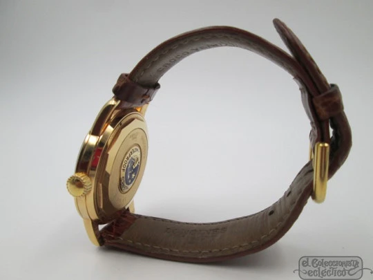 Longines Conquest. 18k yellow gold. Automatic. Date. Enamel anagram