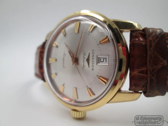 Longines Conquest. 18k yellow gold. Automatic. Date. Enamel anagram