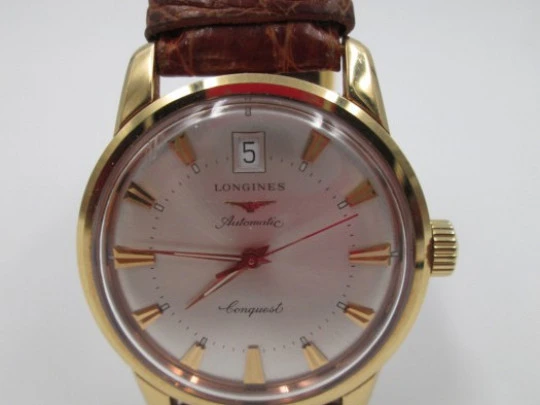 Longines Conquest. 18k yellow gold. Automatic. Date. Enamel anagram
