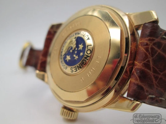 Longines Conquest. 18k yellow gold. Automatic. Date. Enamel anagram