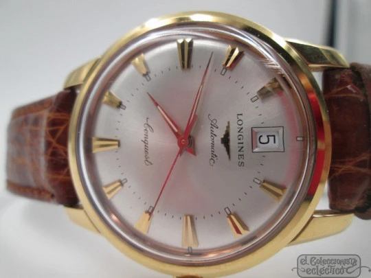 Longines Conquest. 18k yellow gold. Automatic. Date. Enamel anagram