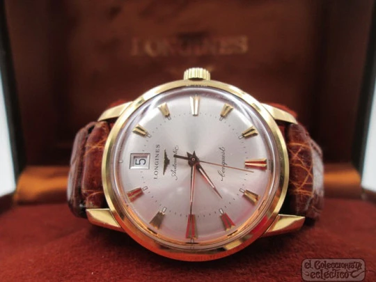 Longines Conquest. 18k yellow gold. Automatic. Date. Enamel anagram