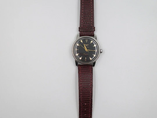 Longines Conquest. Stainless steel. Automatic. Black dial. 1950's. Brown strap Longines Conquest. Stainless steel. Automatic. Black dial. 1950's. Brown strap