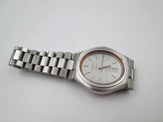 Longines. Acero inoxidable. Automático. Día y fecha. Caja oval. Brazalete. 1970