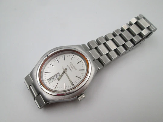 Longines. Acero inoxidable. Automático. Día y fecha. Caja oval. Brazalete. 1970