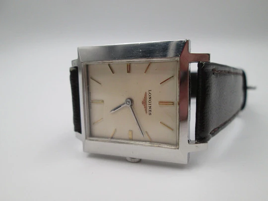 Longines. Stainless steel. 1960's. Manual wind. Rectangular case. Strap