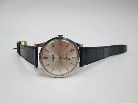 Longines. Stainless steel. 1960's. Manual wind. Seconds hand. Strap. Swiss