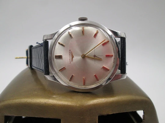 Longines. Stainless steel. 1960's. Manual wind. Seconds hand. Strap. Swiss