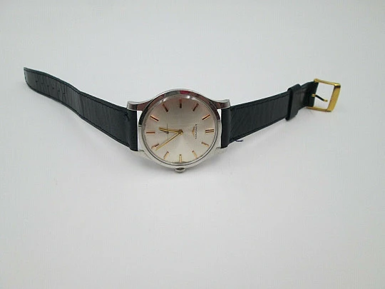 Longines. Stainless steel. 1960's. Manual wind. Seconds hand. Strap. Swiss