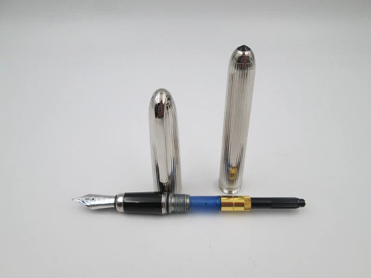 Louis Cartier Stripe fountain pen. Palladium-plated metal and black resin. 2000's. France Louis Cartier Stripe fountain pen. Palladium-plated metal and black resin. 2000's. France