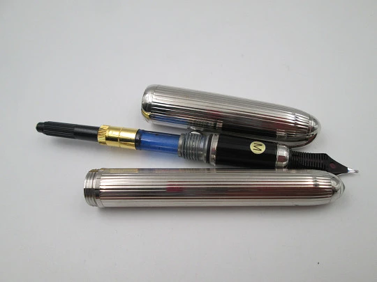 Louis Cartier Stripe fountain pen. Palladium-plated metal and black resin. 2000's. France Louis Cartier Stripe fountain pen. Palladium-plated metal and black resin. 2000's. France