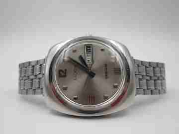 Luxor Tiros. Acero inoxidable. Automático. Brazalete. Día y fecha. 1970. Suiza