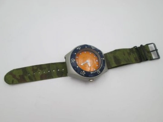 Marble Jumbo. Stainless steel & metal. Quartz. Orange dial. Rotating bezel. 2000's