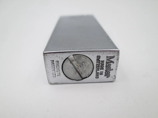 Master petrol pocket lighter. Silver plated metal. Rhomboid pattern. Box. Swiss. 1970's