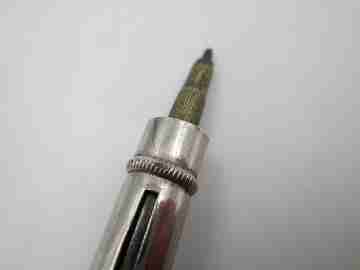 Mechanical combo. Dip pen, retractable pencil and rubber stamp. Silver plated. 1910's