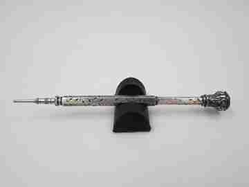 Mechanical propelling twist pencil. Chiselled silver and amber stone. 1900's