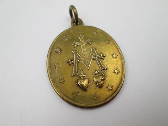 Medalla de bronce Inmaculada Concepción. Anagrama de María. Asa y argolla. 1900
