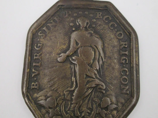 Medalla de bronce. Inmaculada Concepción y Santísimo Sacramento. Octogonal. Siglo XVIII