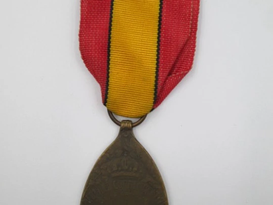 Medalla Primera Guerra Mundial. Bronce. Bélgica. 1919. Banda tela