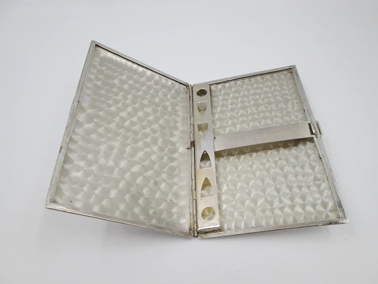 Men's rectangular cigarette case. Sterling silver and Sun's stone motif. Mexico. 1980's