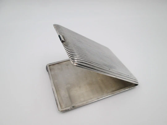 Men's rectangular cigarette case. Sterling silver. Sapphires clasp. Ribbed design. 1950's