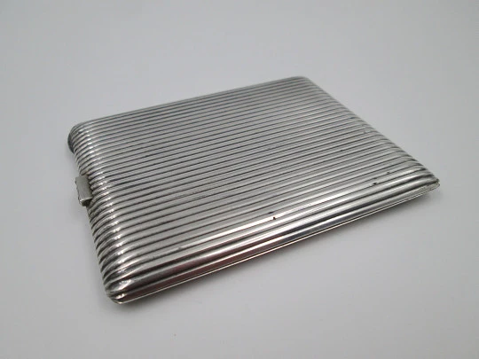 Men's rectangular cigarette case. Sterling silver. Sapphires clasp. Ribbed design. 1950's