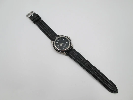 Men's sport watch. Metal and steel. Black bezel. Quartz. Japan. 2000's