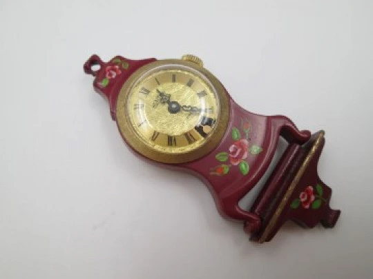 Mentor pendant / desk clock. Gold plated & enamel. Pendulum view
